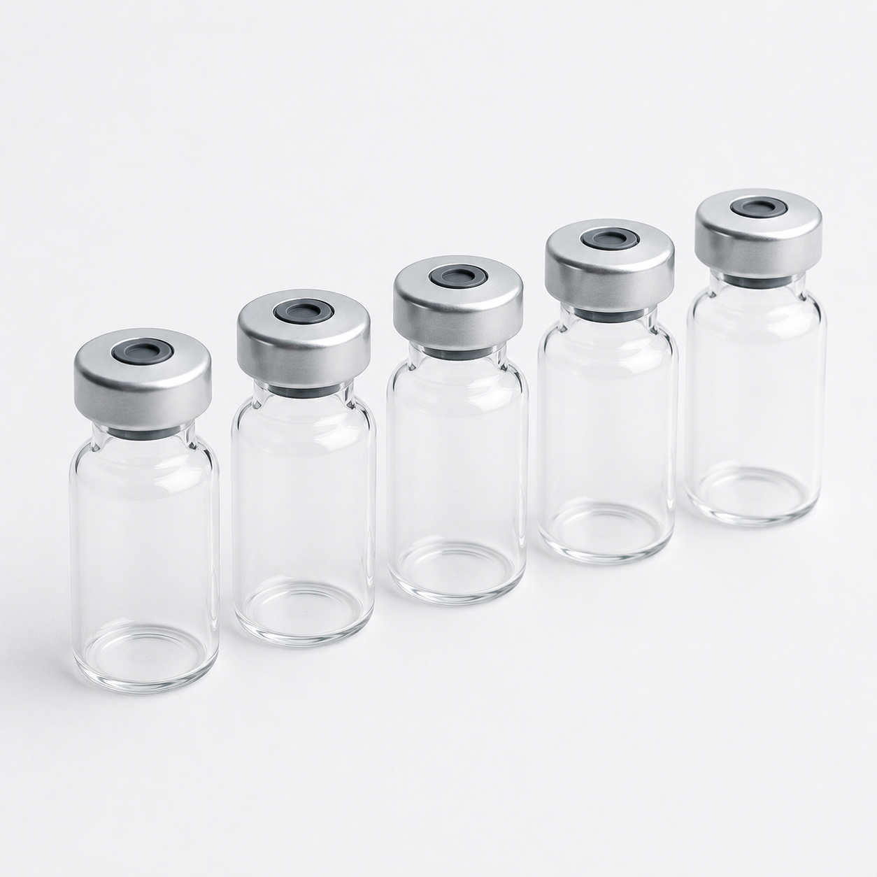 Glass vials with crimped seals for aseptic filling